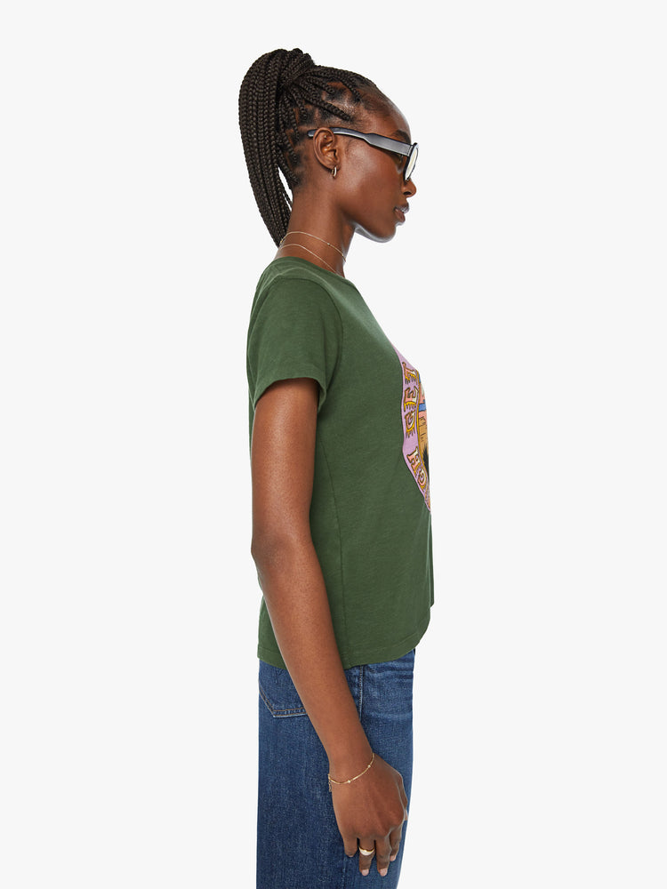 Side  view of a woman forest green tee features a national park-inspired desert graphic with text on the front.