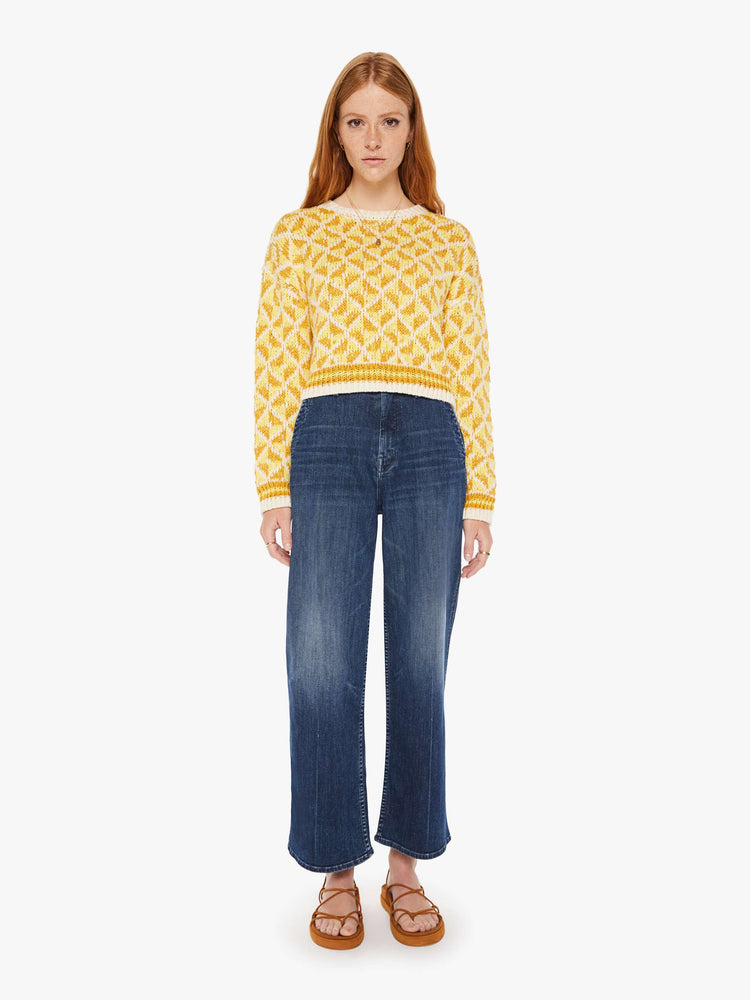 Front full body view of a womens knit sweater featuring a yellow gemetric pattern.