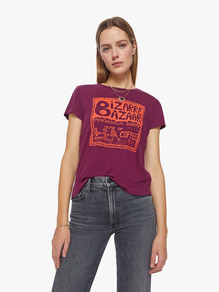 Front view of a woman maroon hue crewneck with a slim fit with an orange graphic inspired by a psychedelic shop from the 60s.