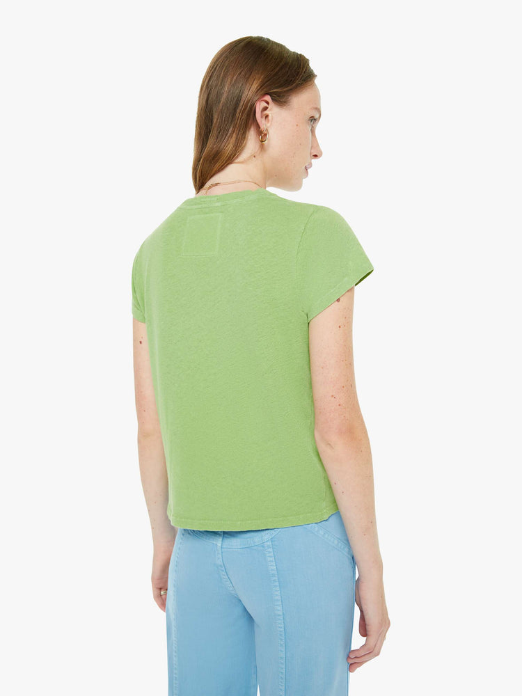 Back view of a woman in a tee is designed in green with a blue text graphic on the front that reads "Trinket Girl."