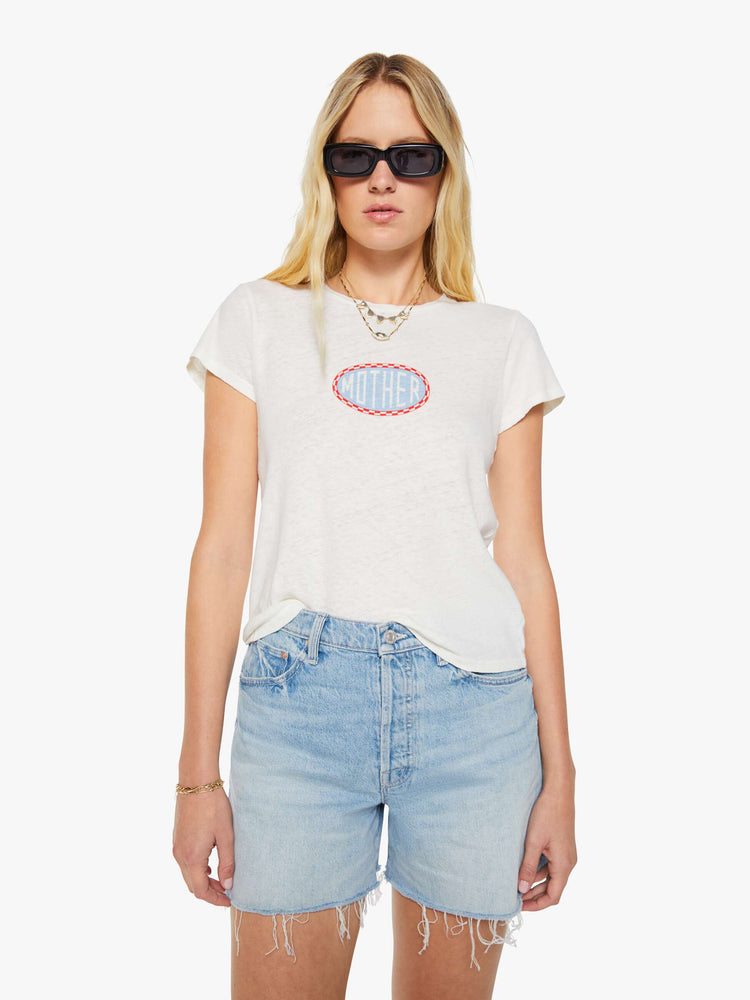 Front view of a woman in a white tee with a light blue and red graphic and MOTHER's name on the front.
