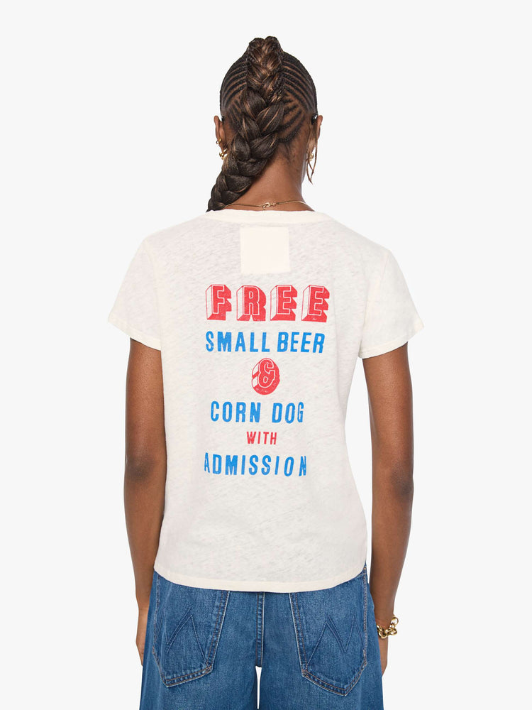 Back view of a woman in an off-white with a vintage-inspired speedway graphic and text in red and blue on the front.