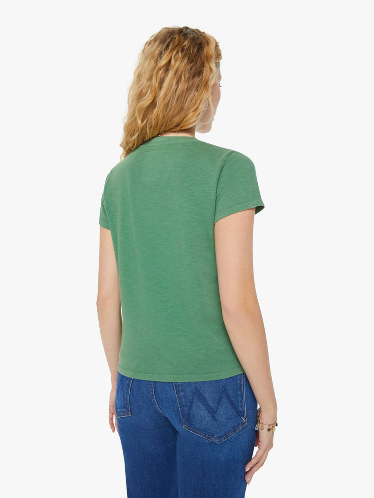 Back view of a woman in a forest green crewneck with a slim fit featuring a hand drawn text graphic "Bon Voyage" in peach styled with blue jeans.