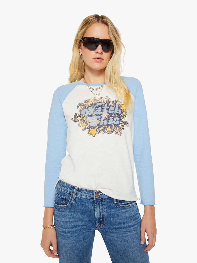 Front view of a woman in a vintage-inspired concert tee is designed with a crewneck, long sleeves, side slits and a relaxed fit. 