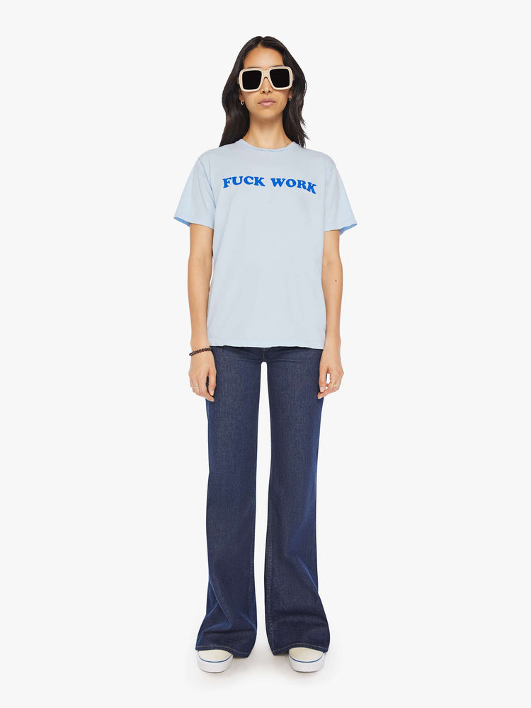 Front full body view of a womens light blue crew neck tee featuring an oversized fit and a blue graphic reading "FUCK WORK".