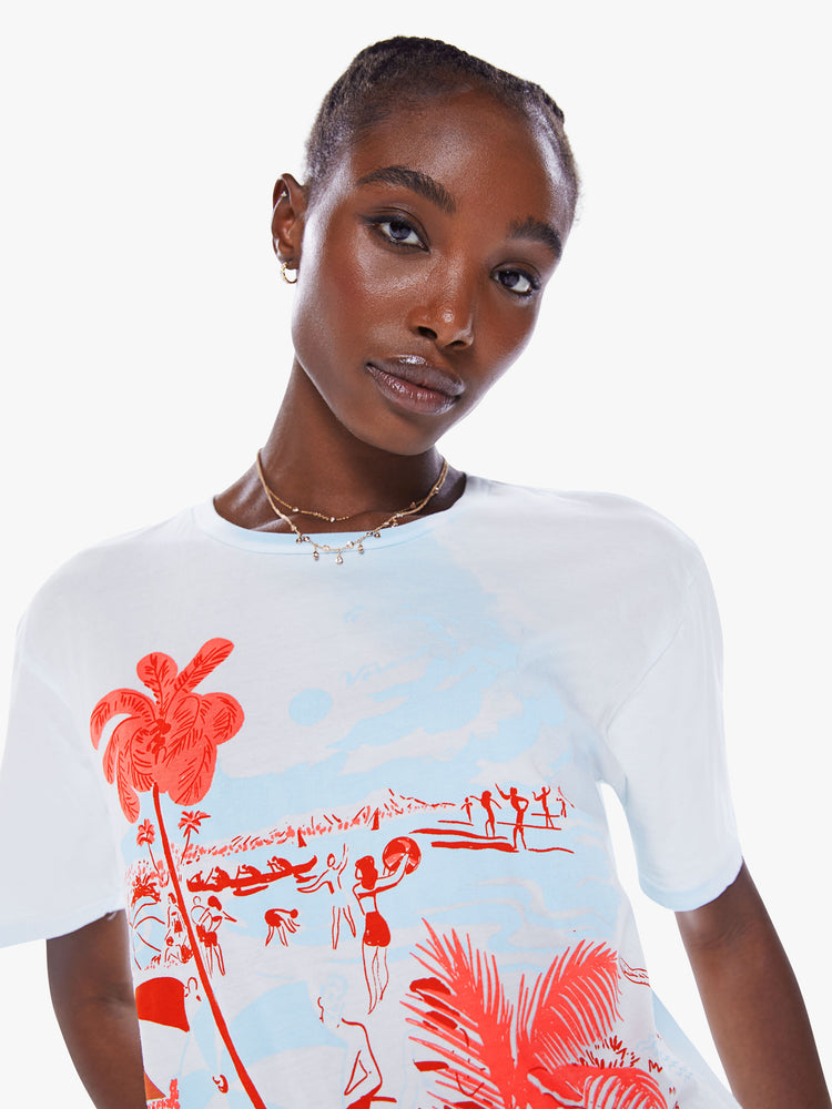 Close up view of a woman crewneck tee with an oversized fit in a semi-sheer off-white tee features a bright red graphic.