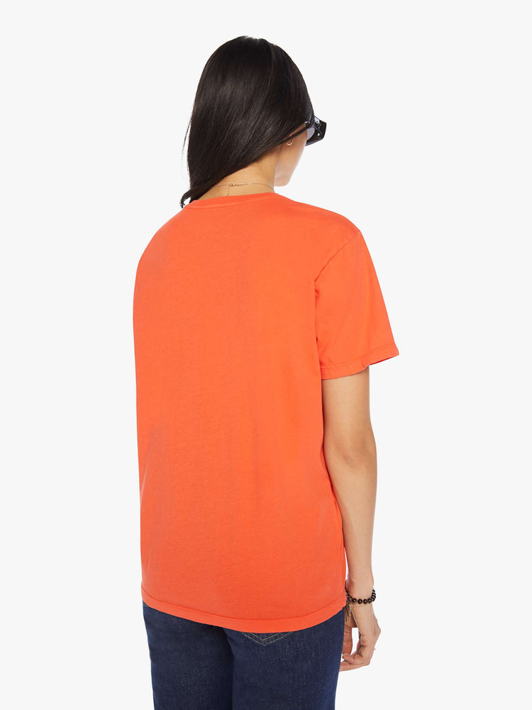 Back view of a womens orange crew neck tee featuring an oversized fit.