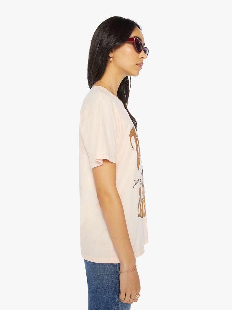 Side view of a womens oversized tee featuring a David Bowie graphic with gold glitter.