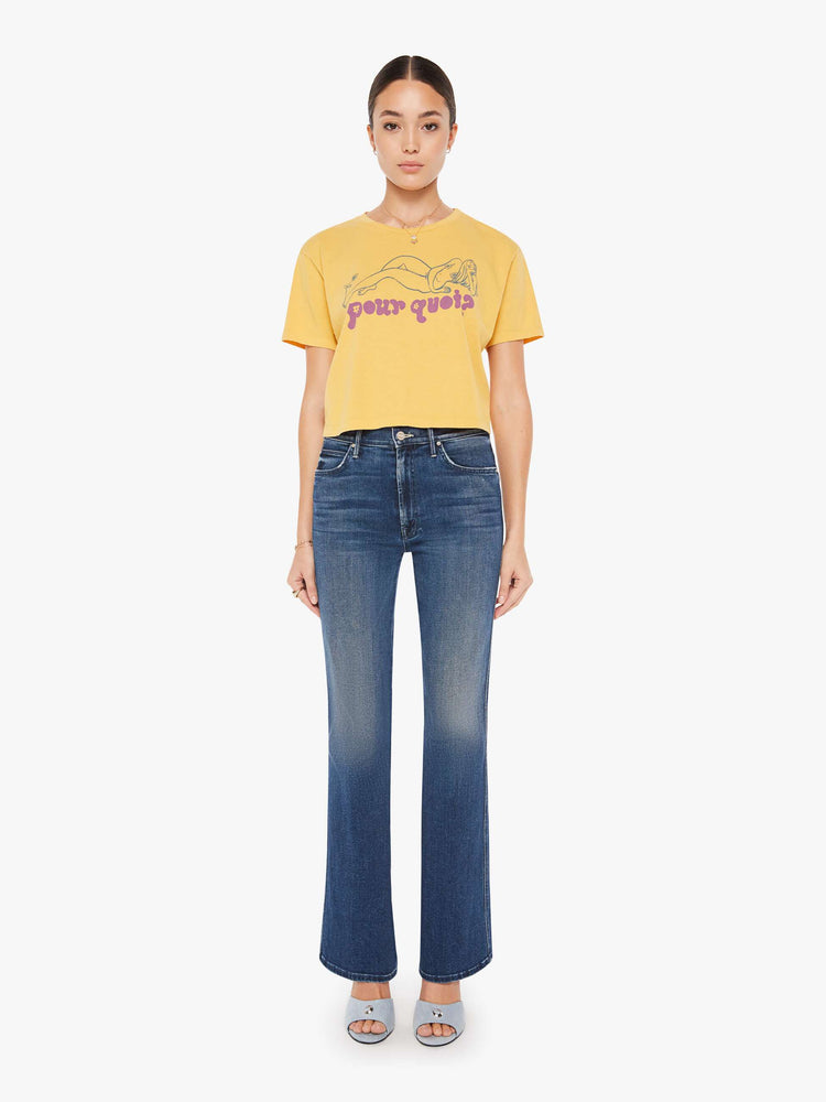 Front full body view of a womens yellow crew neck tee featuring a boxy, cropped fit and a graphic of a woman and "pour quoi?" in purple.