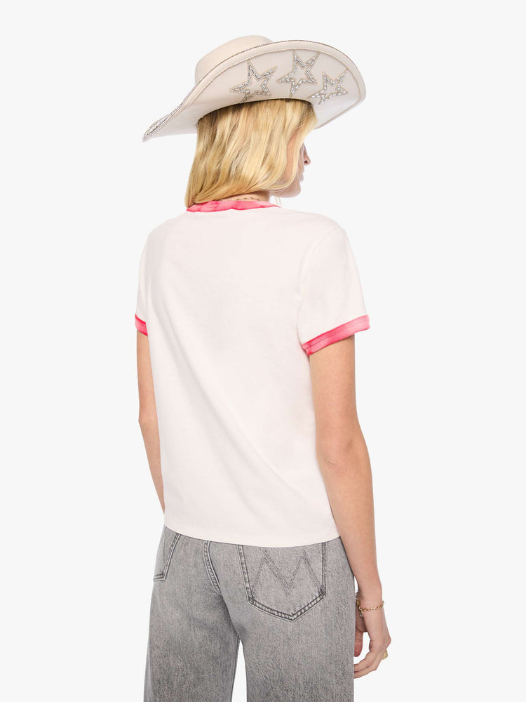 Back view of a woman in a white tee with sun-faded red trim extra-short sleeves and a slightly shrunken fit with a flocked MOTHER graphic across the chest.