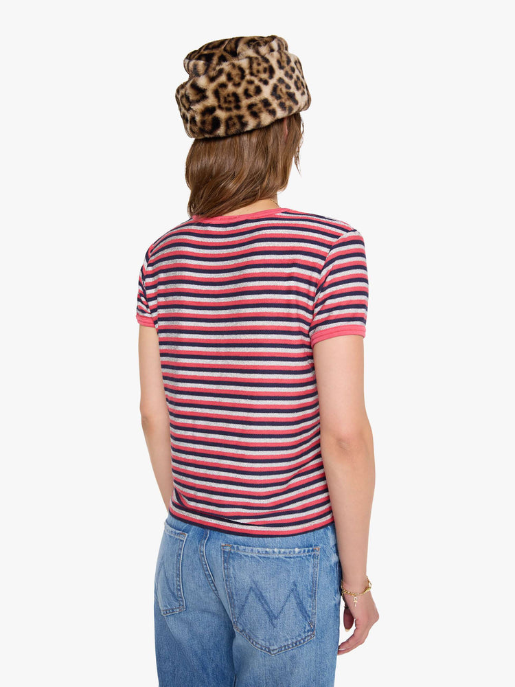 Back view of a woman in a hot pink, navy and glittery silver horizontal stripes tee with extra-short sleeves.