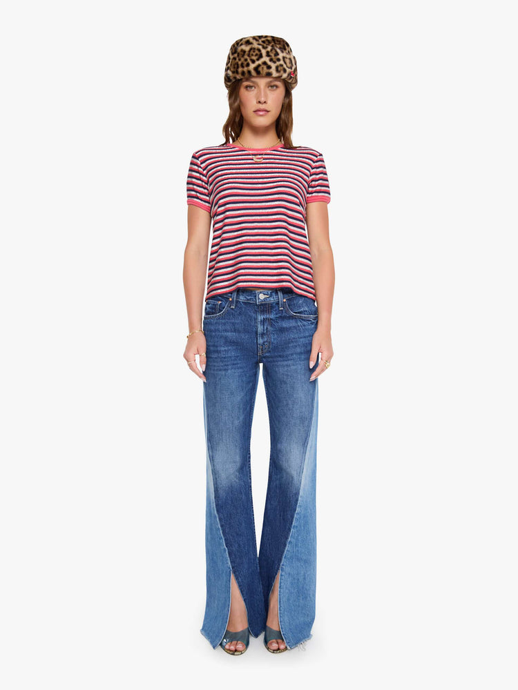 Full body view of a woman in a hot pink, navy and glittery silver horizontal stripes tee with extra-short sleeves.