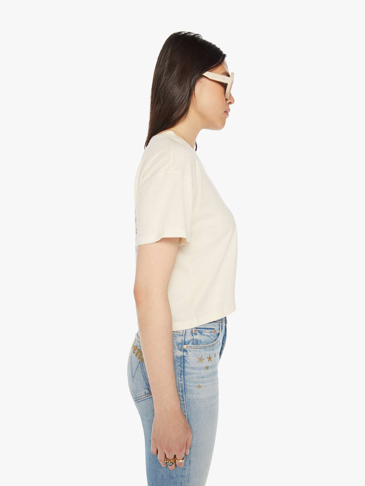 Side view of a womens cropped tee featuring a BOWIE graphic and embroidered details.