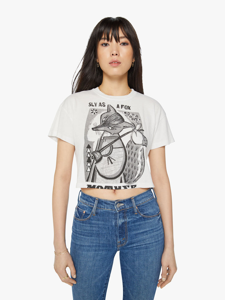 Front view of a woman oversized crewneck tee with drop shoulders, a cropped hem and a boxy fit  in white, the tee features a graphic fox in black on the front.