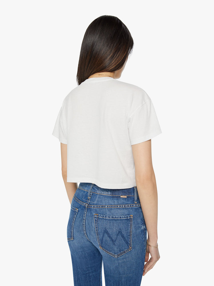 Back view of a woman oversized crewneck tee with drop shoulders, a cropped hem and a boxy fit in white, the tee features a graphic fox in black on the front.