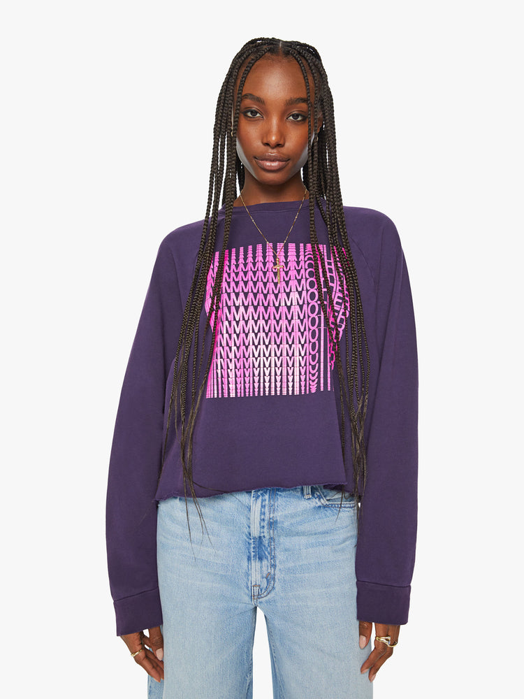 Front view of a woman's cropped sweatshirt with a crew neck, drop shoulders and a raw hem in dark purple.