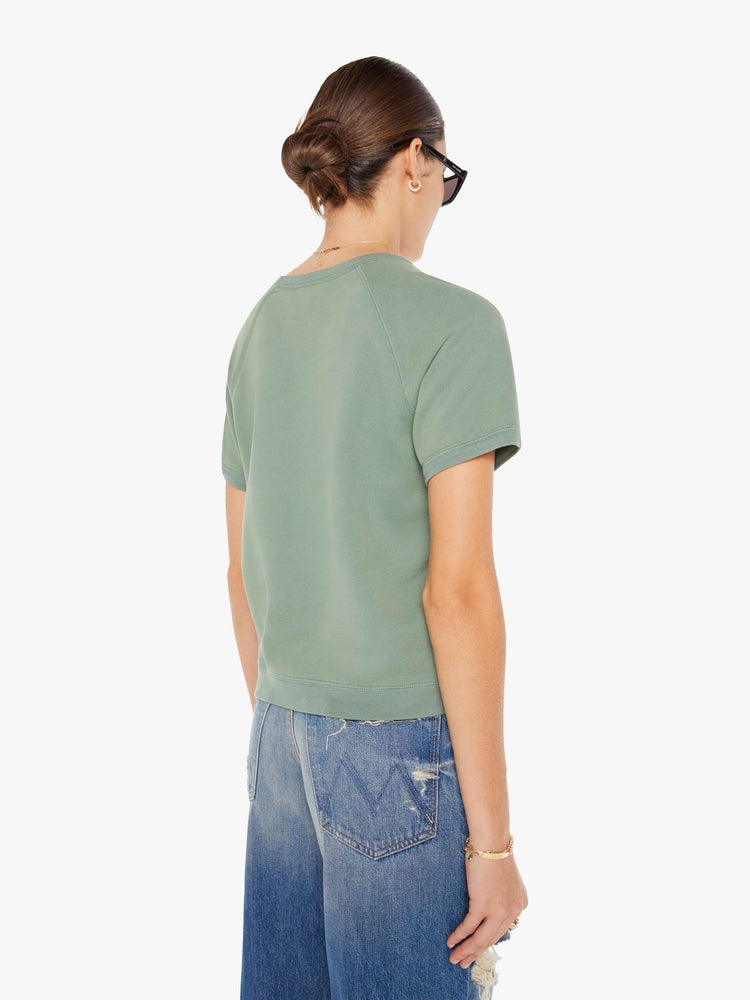 Back view of a womens faded green crew neck short sleeve sweatshirt.