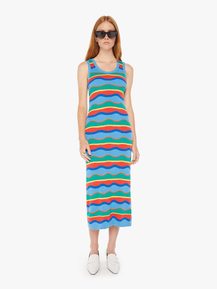 Front view of a woman striped midi dress in a rainbow of primary colors features a slim fit, scoop neck, thick straps and a calf-length hem.