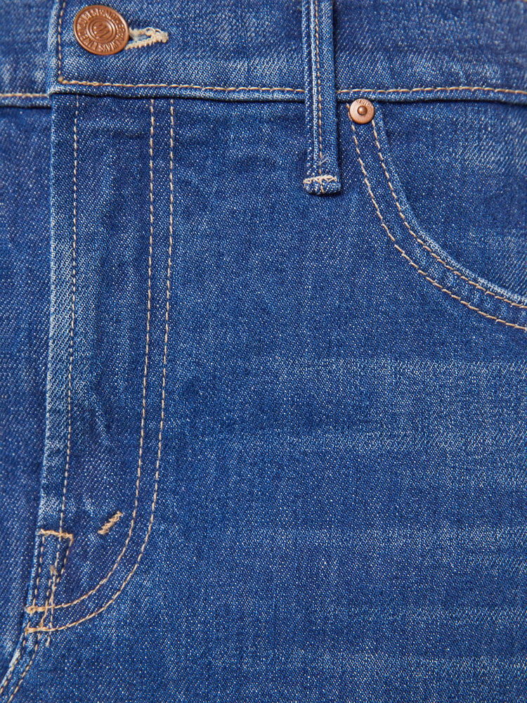 Swatch view of a woman in mid blue knee- length midi skirt with a zip fly, front slit and clean hem.