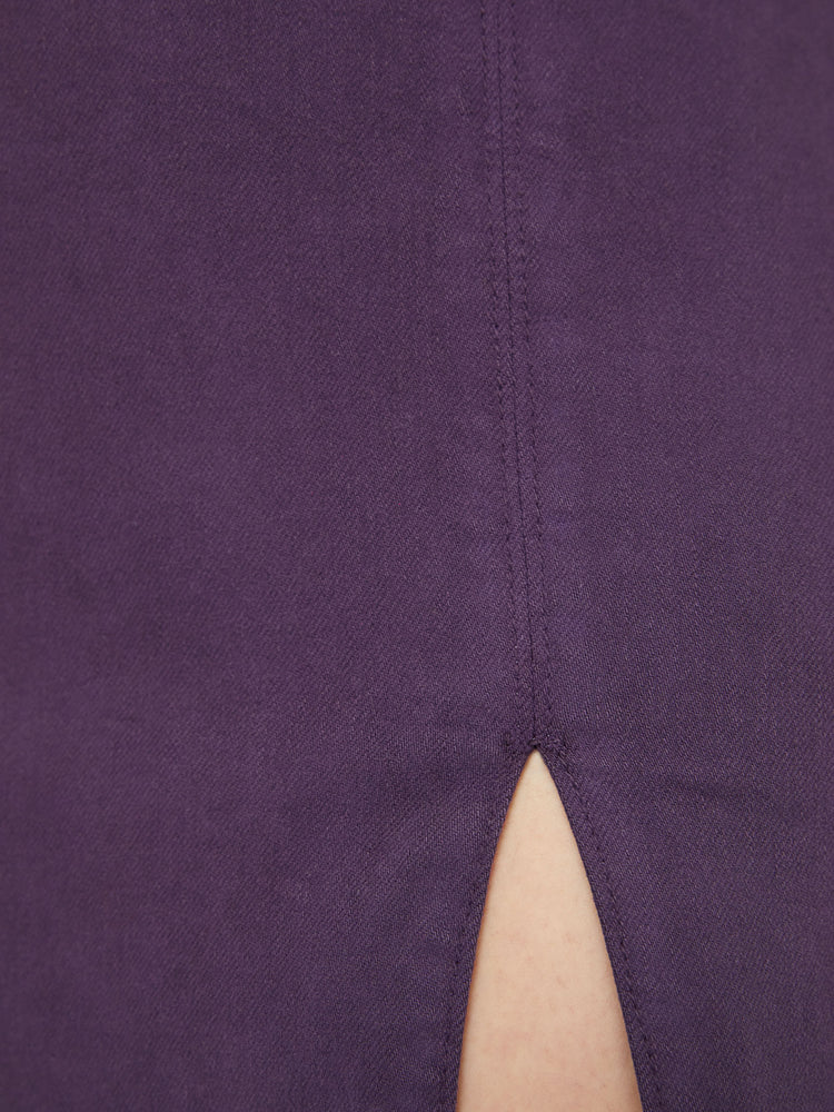 Swatch view of a woman high-waisted mini skirt with a thigh slit, narrow fit and a side zip closure in a blackberry-purple.