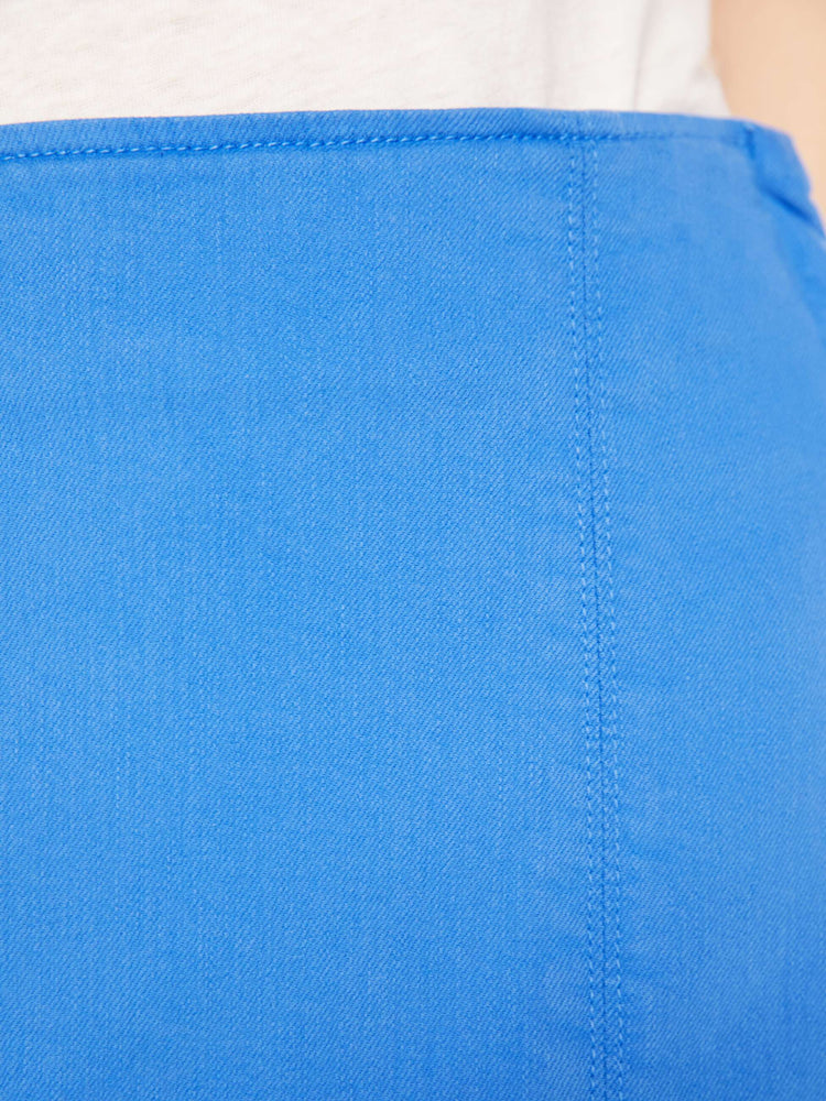 Swatch view of a woman in high-waisted mini skirt with a thigh slit, narrow fit and a side zip closure in a bright blue.