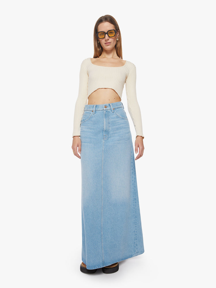 Front view of a woman high-waisted denim maxi skirt features a zip fly, loose A-line fit and a long hem in a light blue wash.