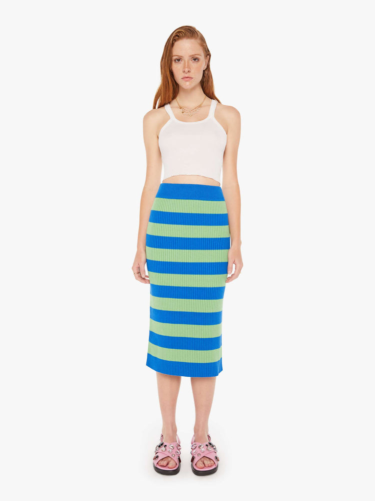 A front full body view of a green and blue striped knit skirt featuring a high rise and midi length.