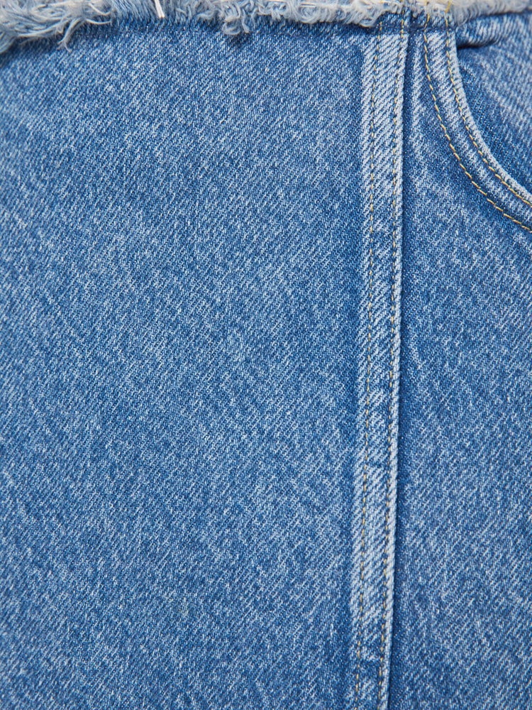 Swatch view of a med blue high-waisted skirt is designed with a frayed waistband and hem, back-zip closure, pintuck details down the front and a loose fit.