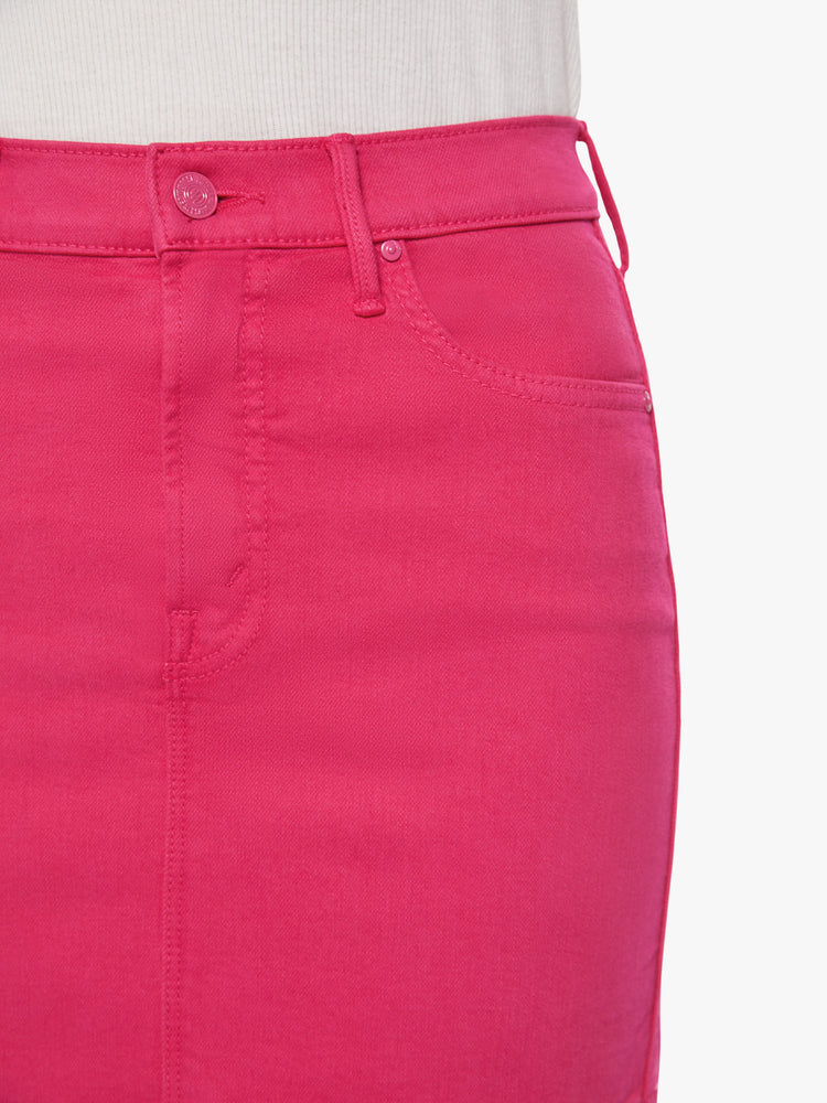 Front waist close up view of a woman high waisted mini skirt with side slit pockets and a playfully short hemline in a hot pink hue.