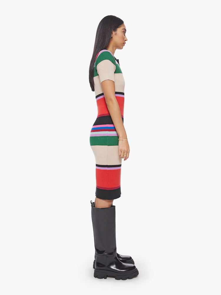 Side view of a woman ribbed cotton blend with a touch of stretch, this colorful striped polo dress features a collared V-neck, short sleeves, a slim fit and a knee-length hem.