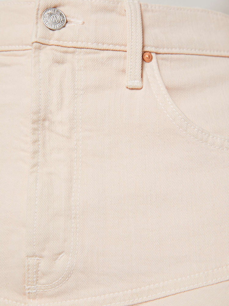 Swatch view of a woman in pure peach high-waisted midi skirt that's fitted at the hips with a zip fly, flowy, gathered skirt and an uneven, frayed hem.