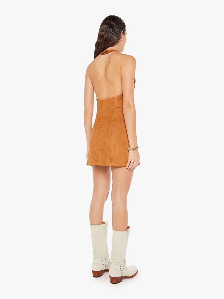 Back view of a womens brown faux suede dress featuring a halter neck.