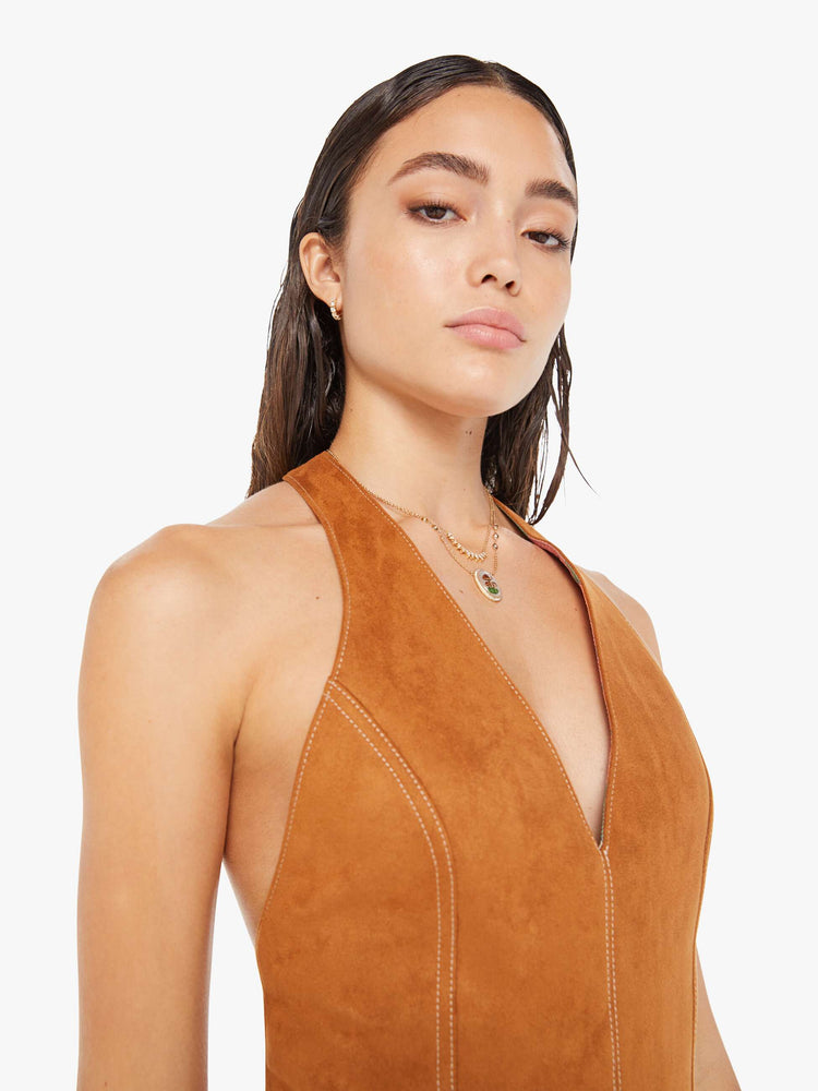 Front close up view of a womens brown faux suede dress featuring a halter neck.