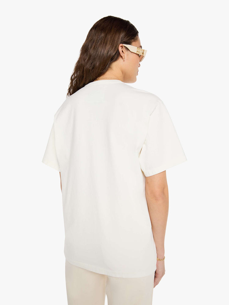 WOMAN back view in a  white top with a MOTHER's spin on the classic Amoeba Music logo in black on the front.
