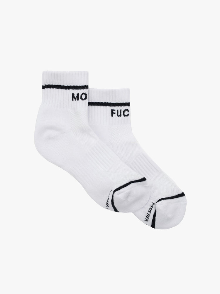 Aerial view of a pair of white ankle socks with the words "MOTHER" "FUCKER".