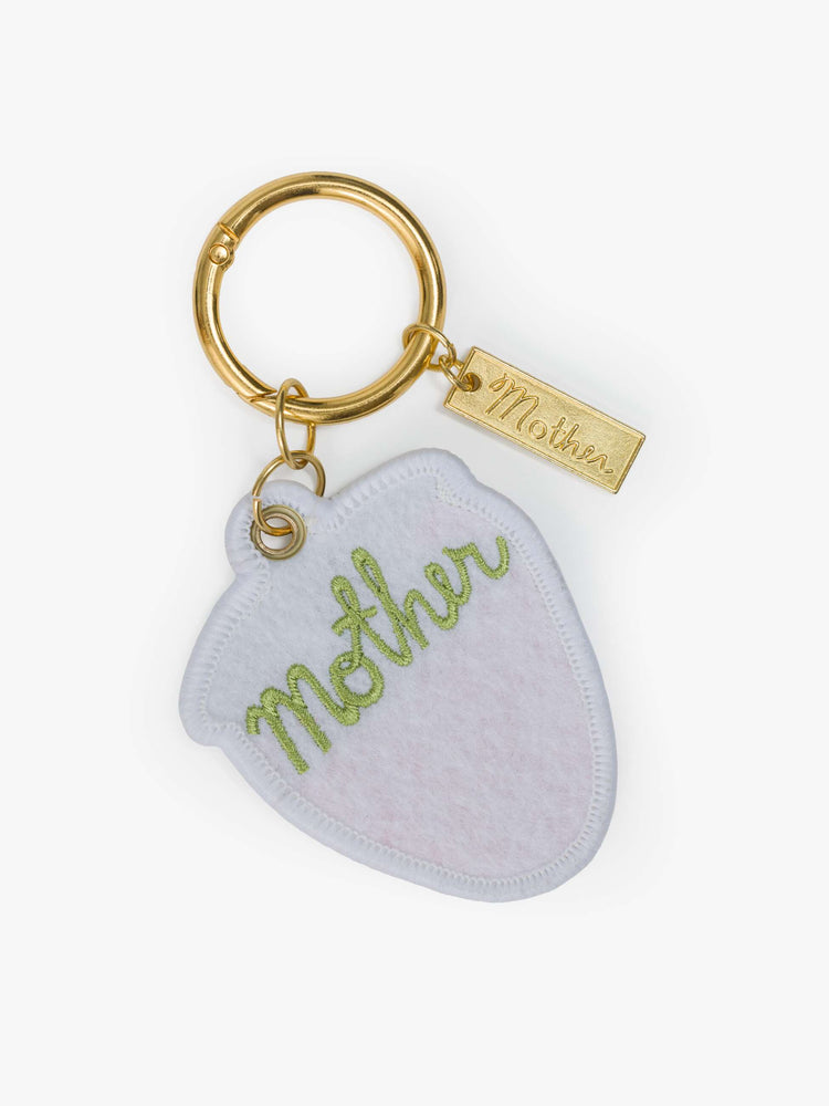Back flat keychain with an embroidered patch with a strawberry on one side and MOTHER's name in green on the other.