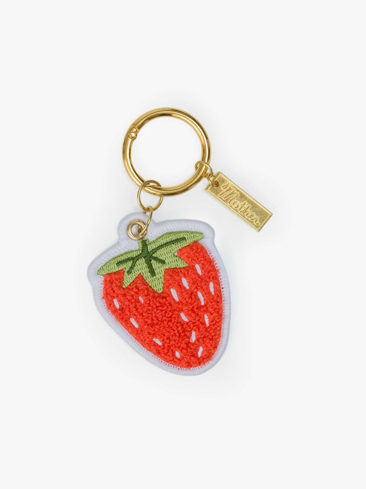 Front keychain with an embroidered patch with a strawberry on one side and MOTHER's name in green on the other.