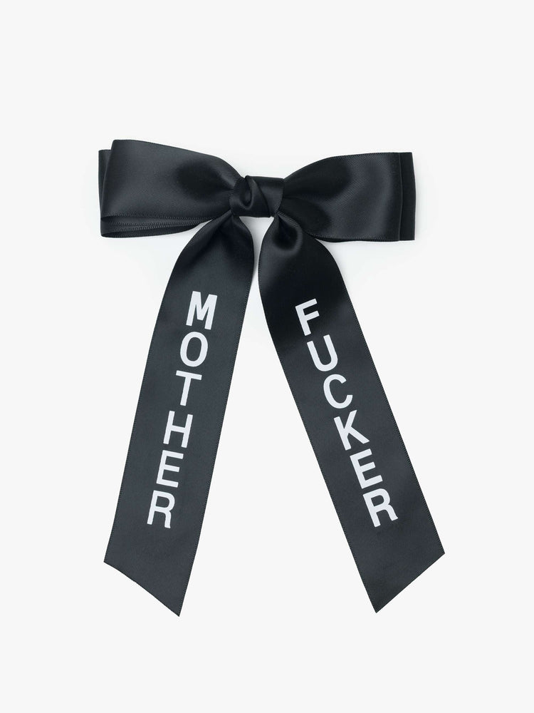 Black satin-feel hair bow that looks sweet but says otherwise—with MOTHER on one tail and FUCKER on the other.