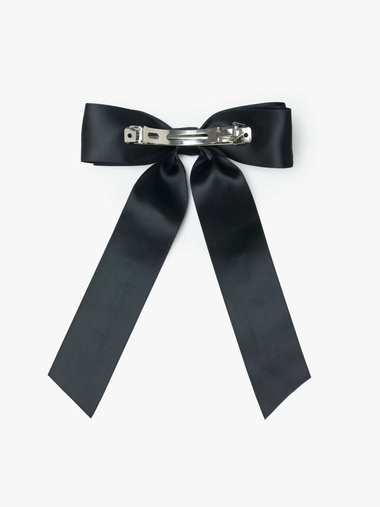 Black satin-feel hair bow that looks sweet but says otherwise—with MOTHER on one tail and FUCKER on the other.
