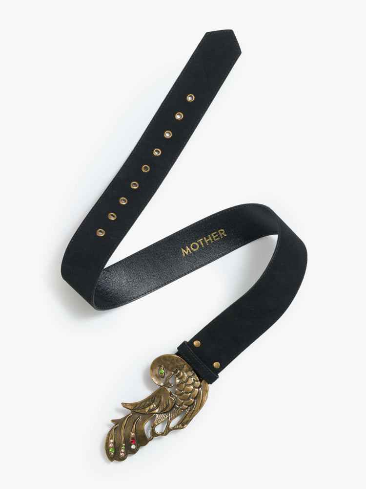 Flat view of a wide leather belt designed in black suede with an oversized antique brass buckle detailed with colored gemstones.