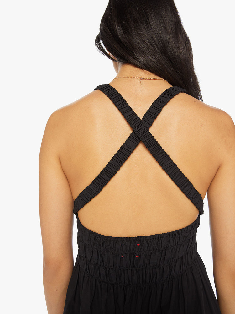 Back close up view of a woman maxi dress in black, sleeveless dress has a crew neck, thick gathered waistband and an ankle-grazing hem.