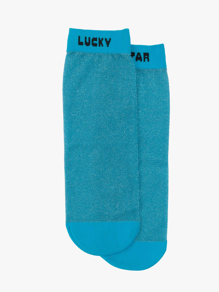 Laying flat view sheer ankle sock designed in glittery turquoise with text in black across the hems.