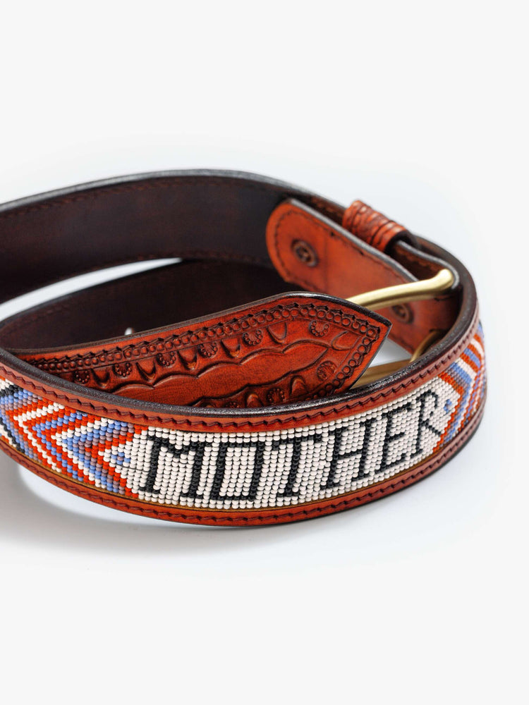 Back flat view of a vintage-inspired leather belt with embossed and beaded details. 
