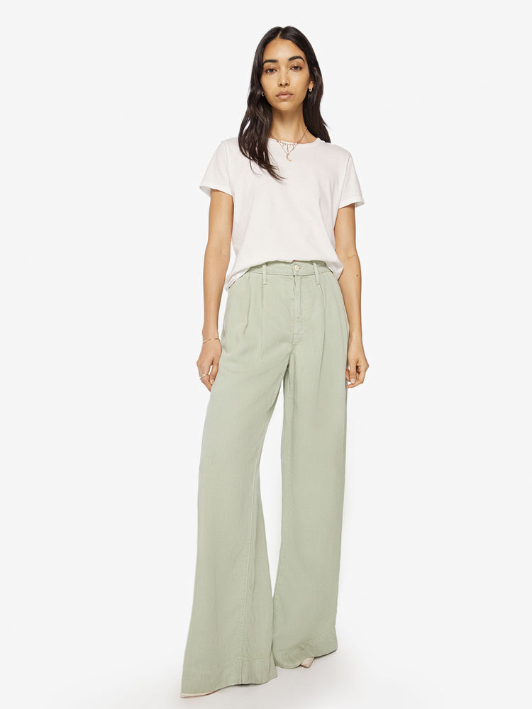 Front view of a woman Super high-waisted wide-leg pants with a long 34-inch inseam that puddles at the hem in a mint green hue.
