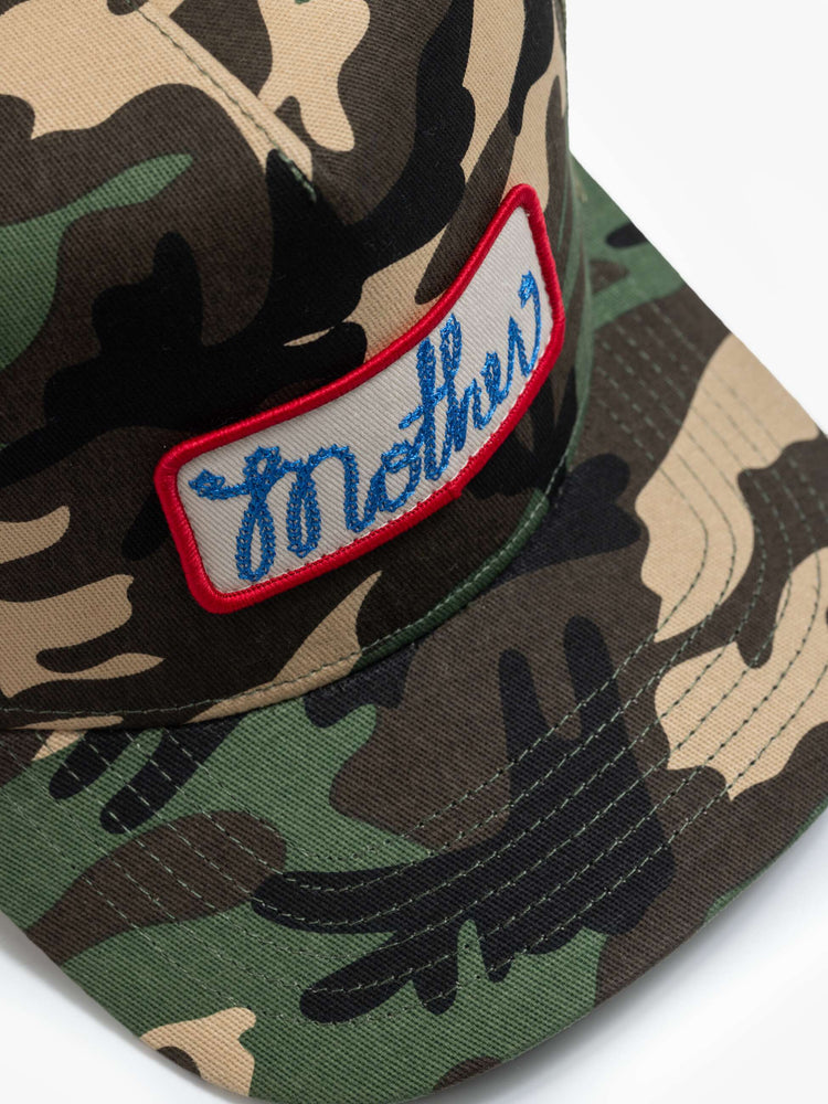 Flat view in a vintage-inspired hat designed in camo featuring a patch with MOTHER's name on the front.
