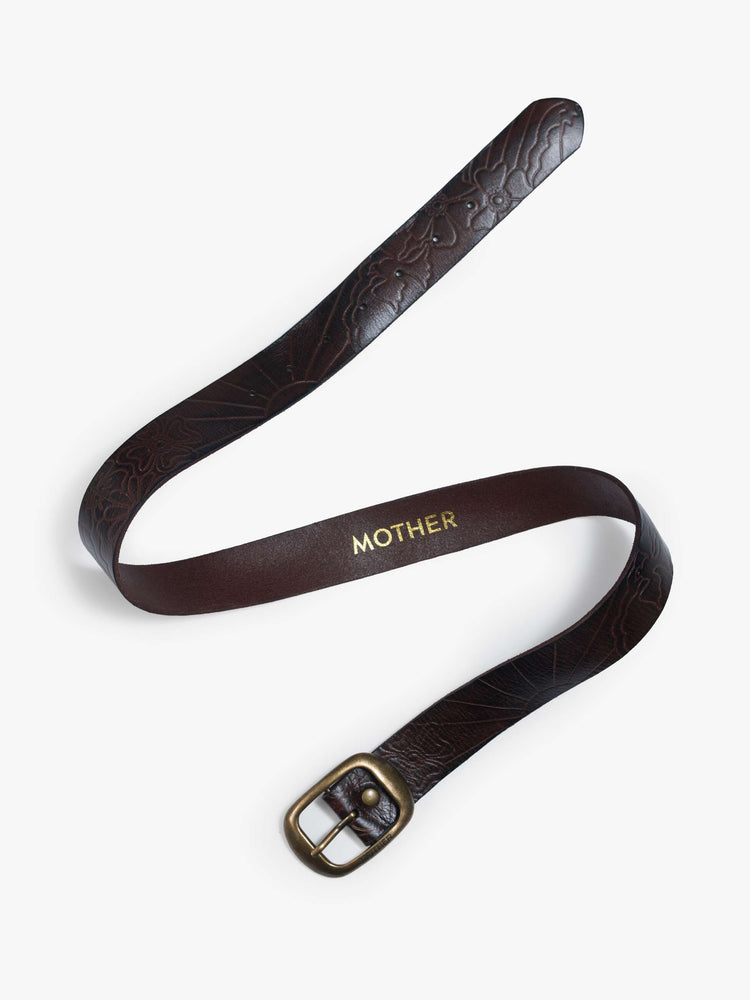 Flat  view of a leather belt with an oversized brass buckle.