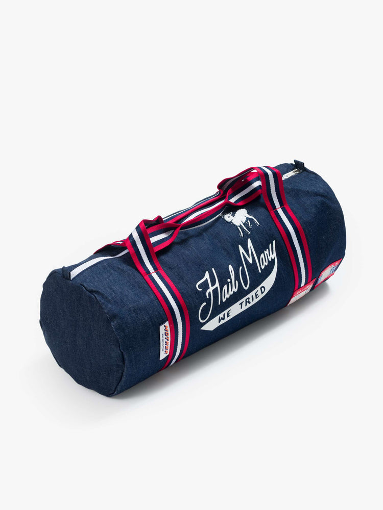 Flat view of a navy blue with red-and-white striped handles duffle bag and features patches, a felt pennant flag and a text graphic in white on the front.