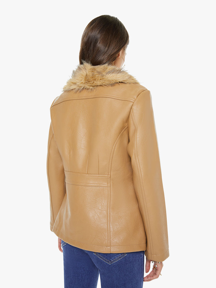 Back view of a woman in a caramel color with faux fur trim at the collar V-neck jacket features front patch pockets, buttons down the front and a tailored fit.