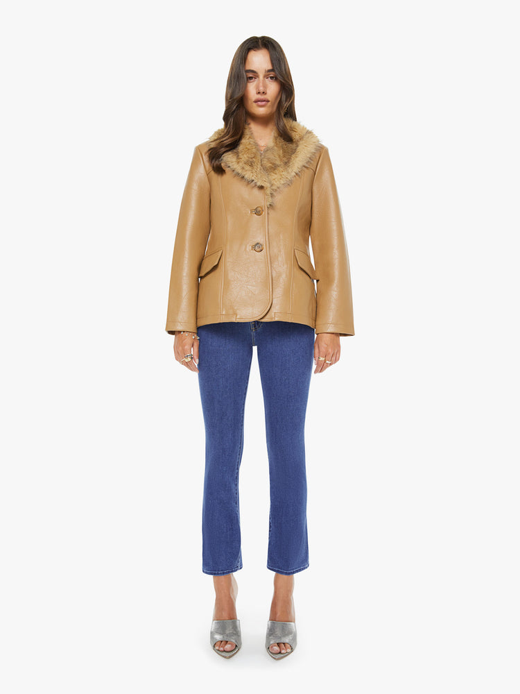 Full body view of a woman in a caramel color with faux fur trim at the collar V-neck jacket features front patch pockets, buttons down the front and a tailored fit.