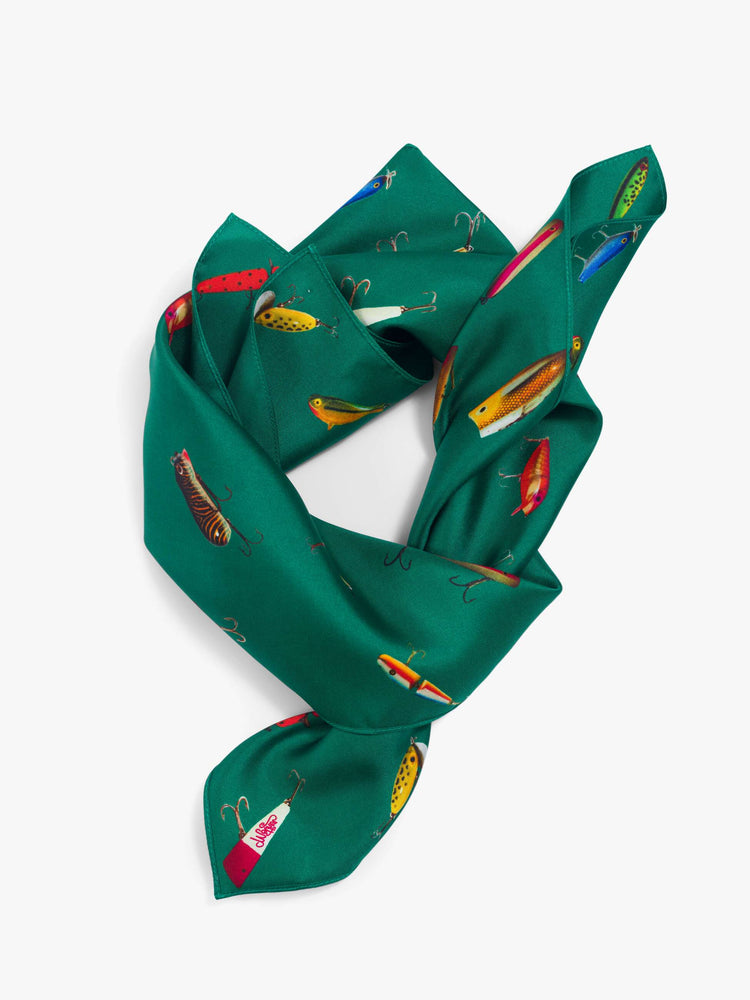 Folding view of a green-teal fish print  of a 25-inch-wide square scarf designed to be worn around the neck, on your head or tied on a bag. 